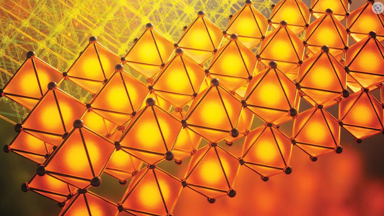 Rows of bright orange tetrahedral shapes against a red/yellow background. 